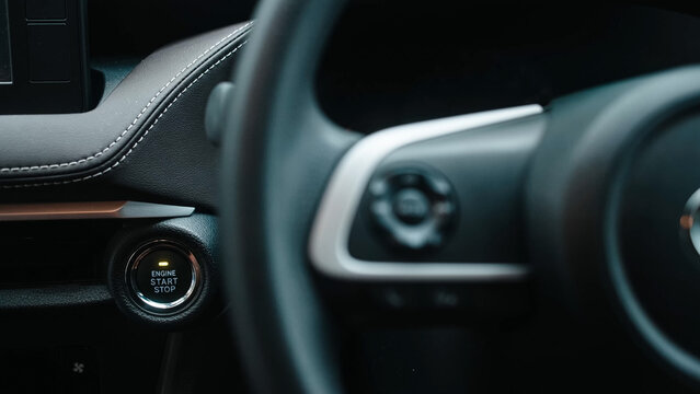 Interior of a modern car with a start button. Concept of comfort, innovative technology, and stylish design for driver convenience.