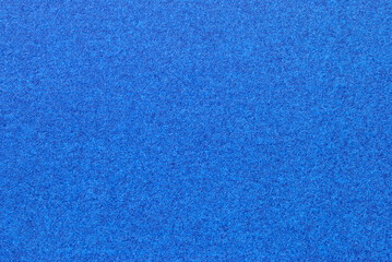 A sheet of blue cardboard texture as background