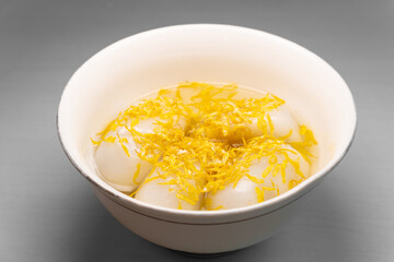 angle view bowl of Chrysanthemum Glutinous Rice Balls at horizontal composition