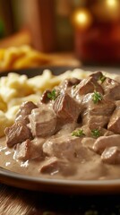 Savory beef stew in creamy sauce served with pasta on a wooden table, appetizing presentation, copy space
