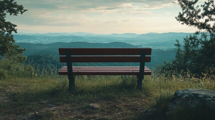 Fototapeta premium Scenic Mountain View with an Empty Wooden Bench on a Hilltop