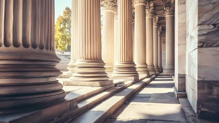A row of classical columns with steps.