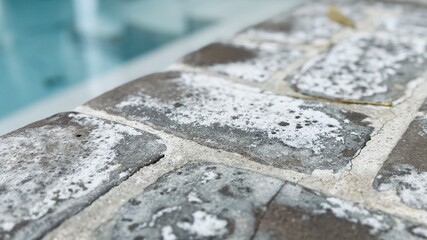Frost-covered ground in the morning, creating a cold and serene landscape.