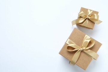 Beautiful gift boxes tied with bows on white background 