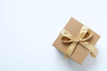 Beautiful gift box tied with bow on white background 