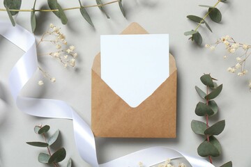 Paper envelpe with eucalyptus branches. Empty greeting card for text design