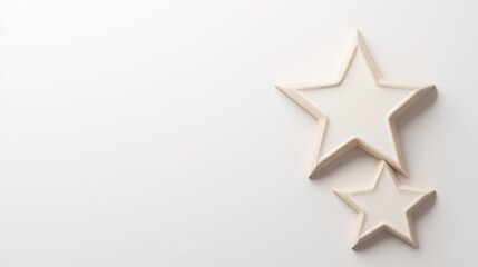 Fototapeta premium Two wooden star shapes on a light background, creating a minimalist and decorative aesthetic.