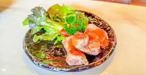 Pork cutlet in steak cooking serve with green vegetable for small portion in restaurant