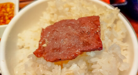 Yakiniku beef Japanese cooking style topping on rice in restaurant