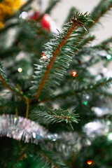 Close-up of shimmering Christmas tree baubles in rich, vibrant colors, reflecting the warmth and joy of the holiday season