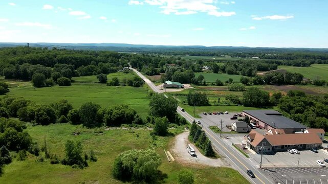 Aerial footage of Bushkill Falls in Lehman Township, Pennsylvania, capturing the stunning waterfalls amidst the Pocono Mountains, surrounded by lush greenery and rugged terrain breathtaking nature