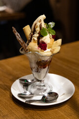 Close-up of a cup of fruit ice cream parfait on the table