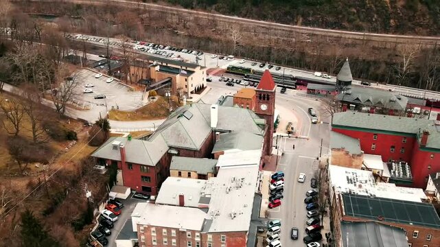 Aerial footage of Jim Thorpe, Pennsylvania, USA, capturing the town's charming streets, historic landmarks, buildings, roads, scenic landscapes, and vibrant neighbourhoods. A picturesque aerial view!
