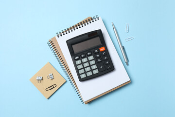 Bookkeepers work place concept. Top above overhead view photo of office accessories calculator, notebook on color backdrop with blank empty space