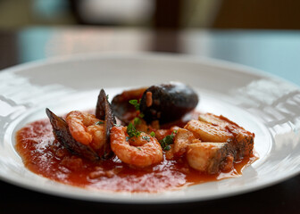 Seafood stew with shrimps and mussels in tomato sauce