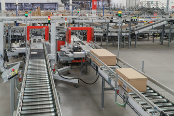 packing line in a logistics warehouse. conveyor belt in a modern production line
