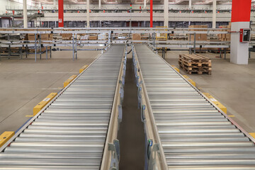 packing line in a logistics warehouse. conveyor belt in a modern production line