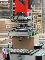 palletizer - packing line in a logistics warehouse. conveyor belt in a modern production line