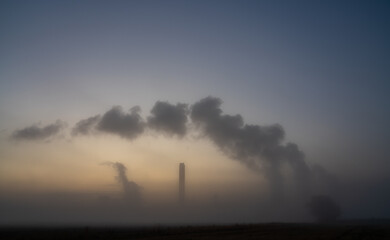 Power station in misty weather