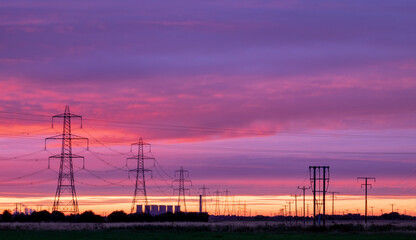 Electricity power infrastructure at sunrise