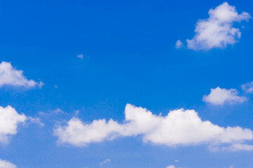 The sky is clear blue with some clouds.