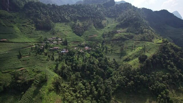 A picturesque village in a green valley surrounded by mountains 4K view Ha Giang Loop Vietnam Asia