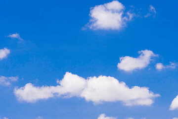 The sky is clear blue with some clouds.