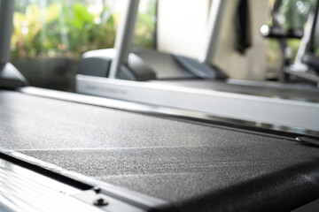 Running treadmill machine at the indoor fitness center. Sport equipment workout concept scene,...