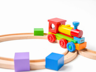 Wooden toy train isolated on white background.