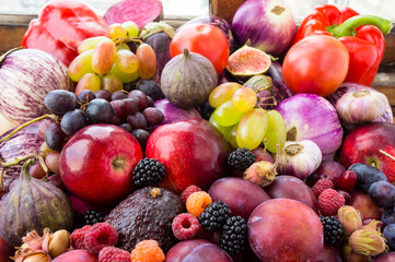 Various fresh autumn fruits and vegetables.Background of rich colors of autumn fruits, berries and vegetables.