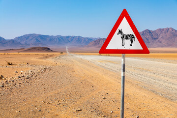 Caution Zebra, wildlife road sign in the NamibRand Nature Reserve in Namibia, Africa