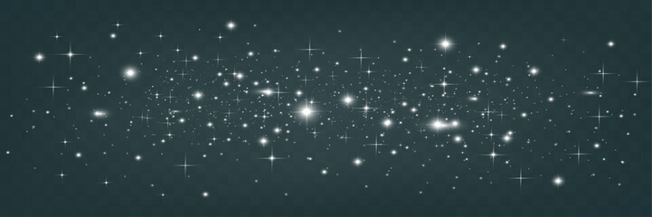 Fototapeta premium Bright glowing sparkles on a transparent background, resembling a starry or glittering effect.