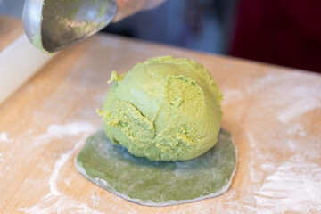 Green tea mochi with ice cream for dessert preparation.