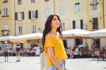 Beautiful smiling  woman on the street in Italy 