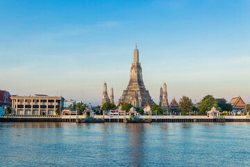 Naklejka premium Beautiful of Buddhist temple or Wat Arun Ratchawararam Ratchawaramahawihan with famous tourist landmark sunlight in the morning, Bangkok, Thailand.