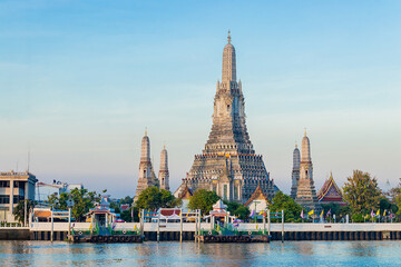 Beautiful of Buddhist temple or Wat Arun Ratchawararam Ratchawaramahawihan with famous tourist landmark sunlight in the morning, Bangkok, Thailand.