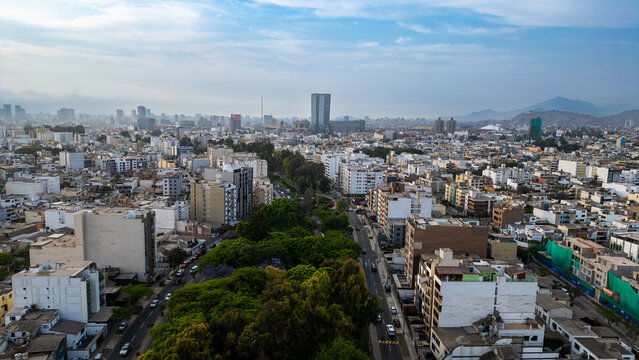 Panoramic view of the modern and busy district of San borja in Lima in Peru on a summer afternoon with blue sky and a large skyscraper on the horizon
