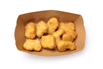 Delicious chicken nuggets in carton box isolated on white, top view