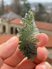 Green Moldavite shaped like a feather