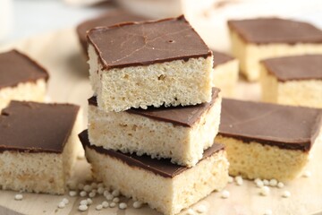 Delicious puffed rice bars on table, closeup