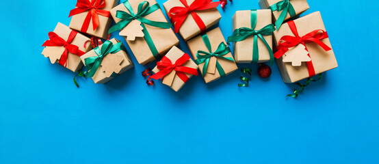 wrapped christmas or other holiday handmade present in paper with colored ribbon. Present box,...