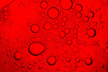 Red macro drink texture,Red close-up macro drink water drop surface,Water droplets on a glass of...