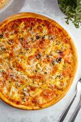 traditional Italian pizza on a white plate