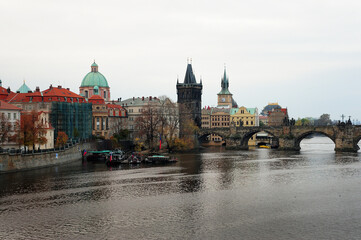 A Vltava River scene in Prage, Czech Republic, with the Charles Bridge in the backgroun