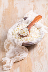 Curd cheese in a bowl on kitchen table