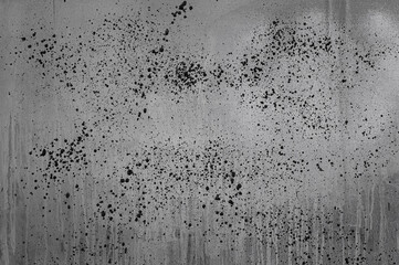 gray background, on a gray wall with streaks, splashes and strokes of paint