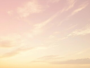 A pastel gradient sky with soft pink and orange tones, featuring faint clouds, ideal for modern and calming backgrounds