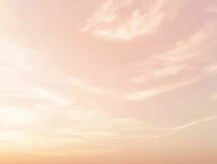 A pastel gradient sky with soft pink and orange tones, featuring faint clouds, ideal for modern and calming backgrounds