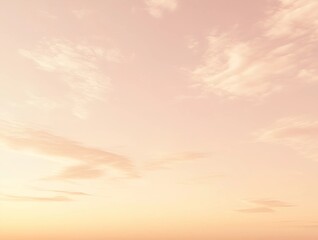 A pastel gradient sky with soft pink and orange tones, featuring faint clouds, ideal for modern and calming backgrounds