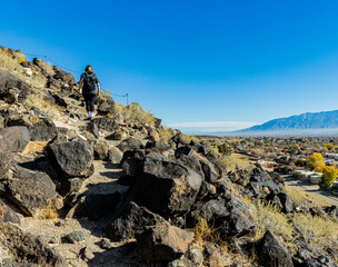 Female Hiker on Mesa Point Trail in Boca Negra Canyon, Petroglyph National Monument, Albuquerque, New Mexico, USA